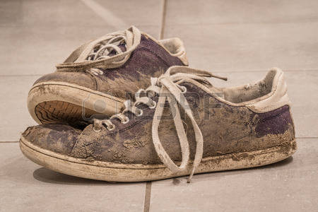 54123650-dirty-shoes-with-mud-and-soil-on-a-floor